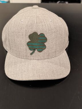 The Classic Heather Gray Snapback Hat with Green Clover Patch